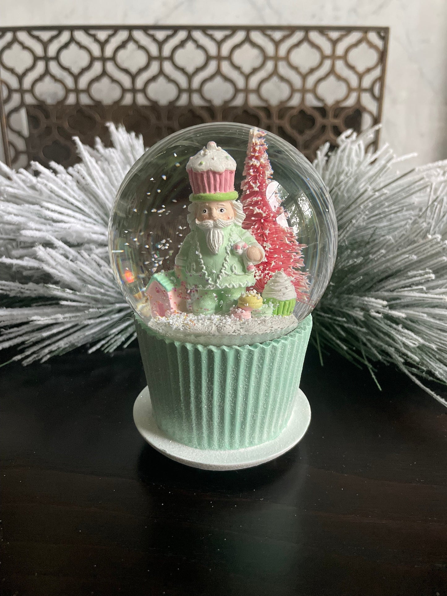 6" Cupcake and nutcracker water music globe. Pastel colors. Candy. Music jingle bells.