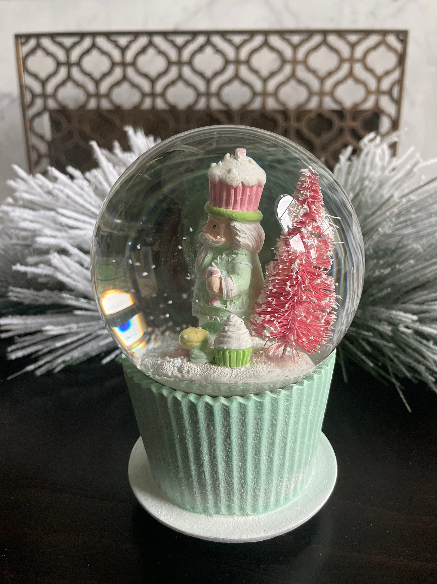 6" Cupcake and nutcracker water music globe. Pastel colors. Candy. Music jingle bells.